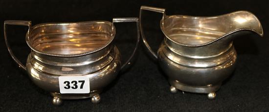 A George V two pieces silver strawberry and cream set